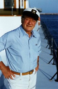 John Wayne is shown aboard his boat, the Wild Goose, in 1977. (Bert Minshall)